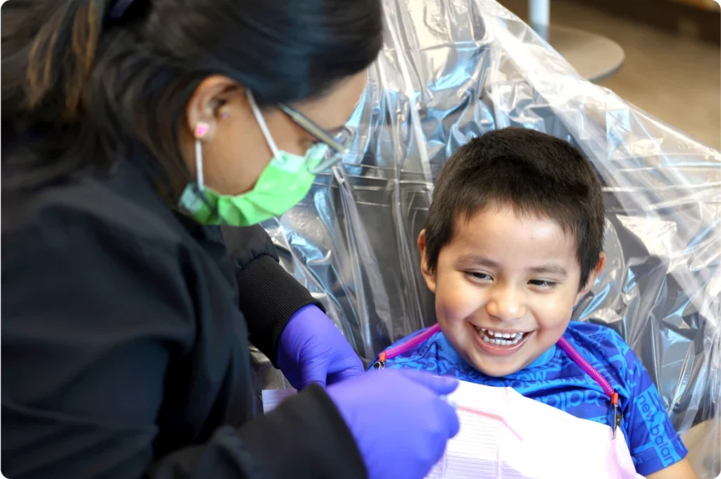 A dentist giving a young child a dental check up