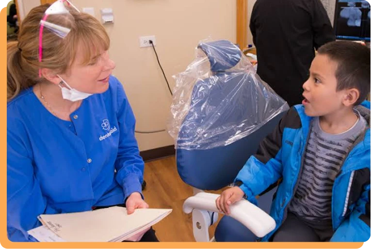 Dental Aid dentist speaking with a patient