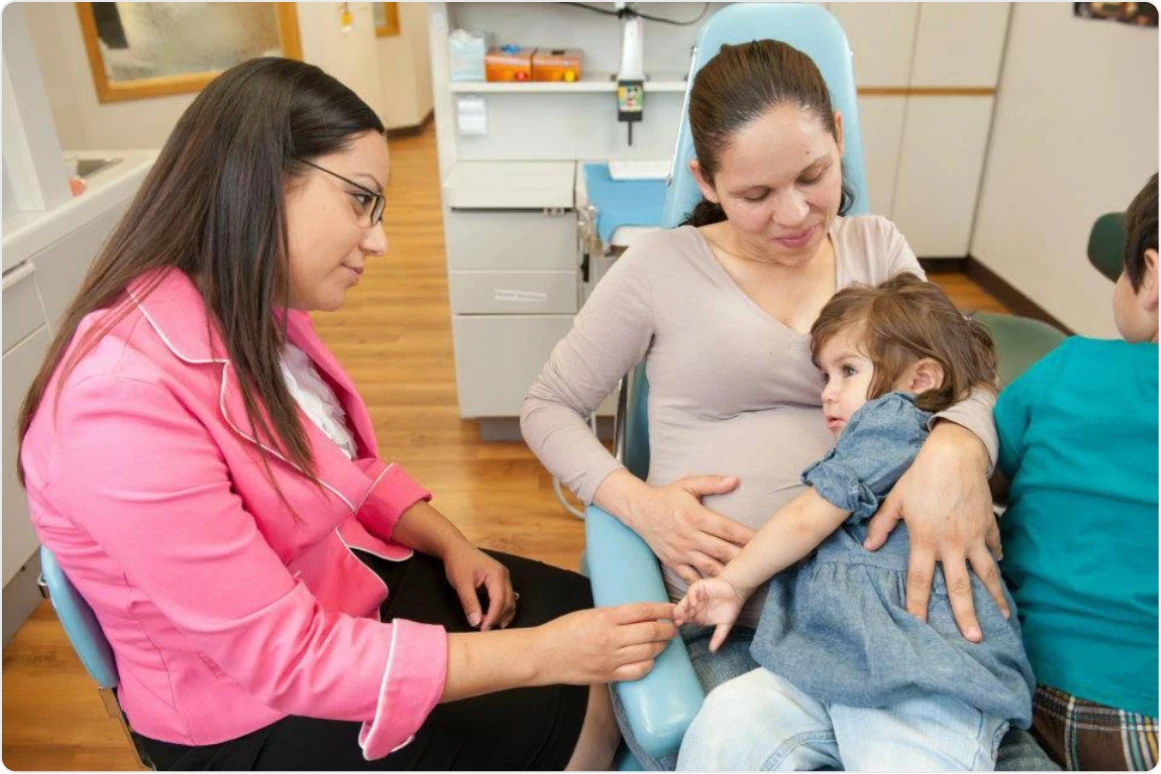 A dentist meeting with patients