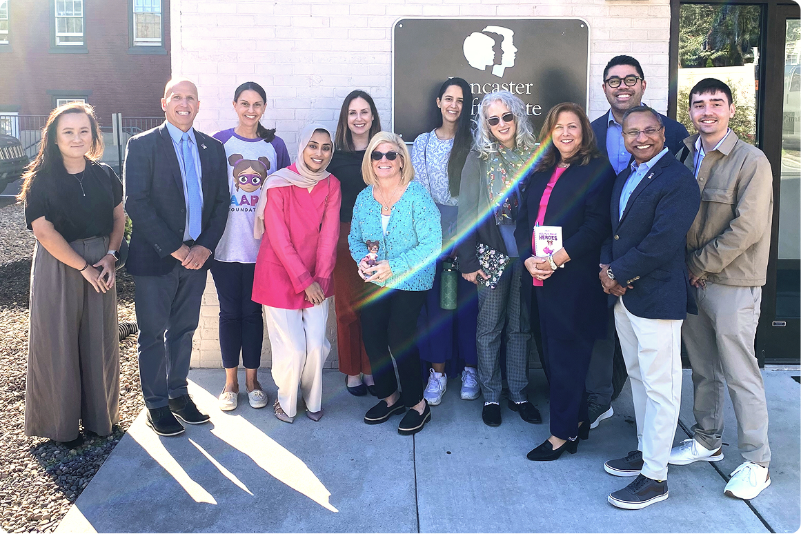 The team at Lancaster Cleft Palate Clinic, the first cleft palate clinic in the United States, stands with representatives from the AAPD Foundation.
